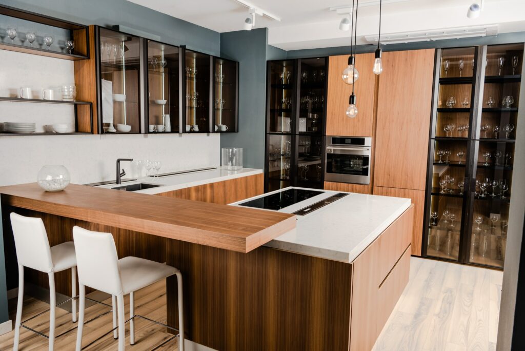 interior of luxury wooden kitchen with comfortable furniture and many shelves